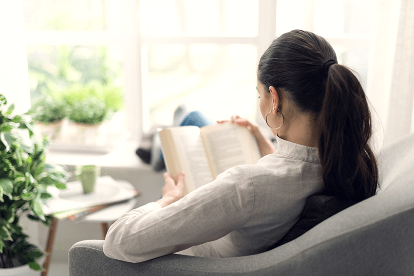 cbd and memory | understanding memory and cognitive function | the ECS | blog image of woman reading a book on the couch