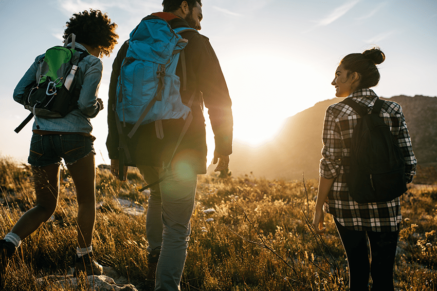 image of friends going on a hike by a mountain for the blog about The Secret to Amplifying the Effects of CBD & CBG with These Common Supplements! | CBG vs CBD | CBD vs. CBG
