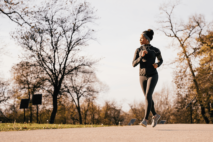 image of a woman running on a fall day for the blog about 5 Daily Exercises to Incorporate with CBD for A Better Life
