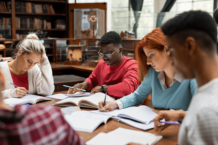 5 Effective Ways to Create Back to School Bliss 6 image of college students studying for a test in a library for the blog about 5 Effective Ways to Create Back-to-School Bliss