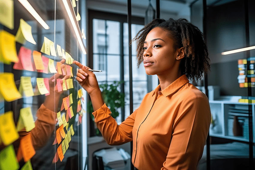 5 Key Strategies for Setting Goals and Achieving Them with Daily CBD 2 image of a woman planning with a board of sticky notes for the blog about 5 Key Strategies for Setting Goals and Achieving Them with Daily CBD