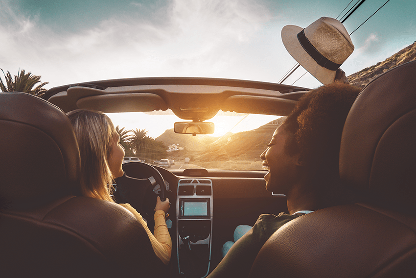 Navigating Your CBD Lifestyle: Selecting the Perfect CBD Products for Your Way of Life 13 image of girls on a road trip in a convertible with the top down and smiling while having a good time for the blog about Navigating Your CBD Lifestyle: Selecting the Perfect CBD Product for Your Way of Life