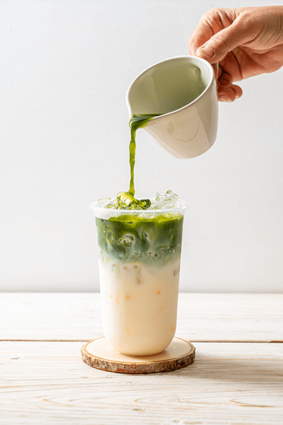 image of an iced matcha latte for blog about How To Make A Matcha Latte with CBD | Hot & Iced