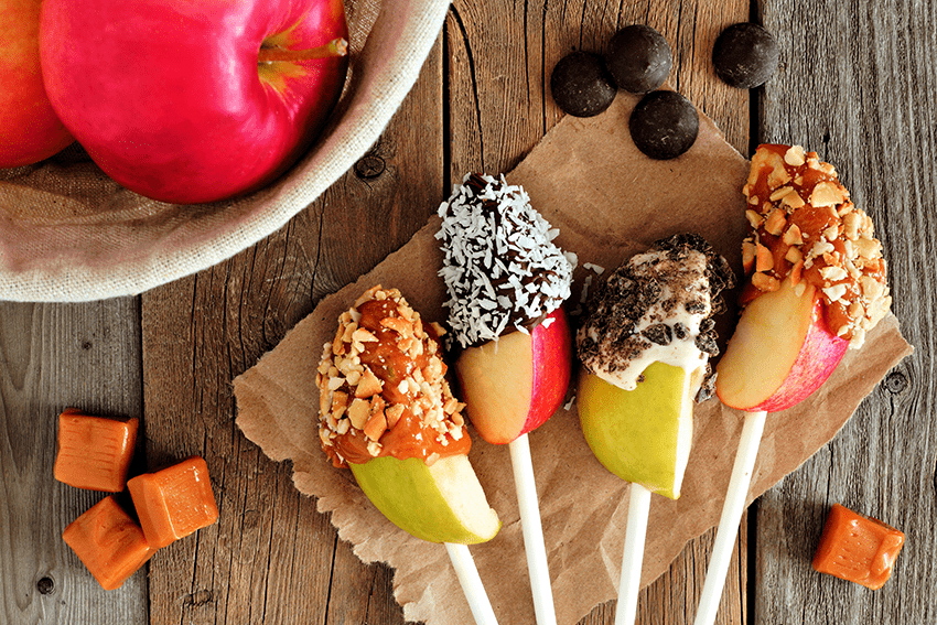 image of halloween inspired candy coated apple slices for blog about Hauntingly Delicious Halloween Recipes