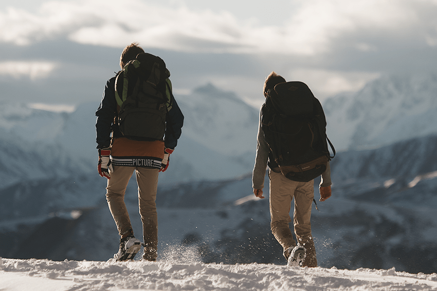 Extract Labs Holiday Gift Guide 2023 22 image of friends hiking in the snow on a mountain for blog about Extract Labs Holiday Gift Guide 2023 | CBD Gifts | Pet Gifts | Dog Gifts | Cat Gifts | Gifts for Cat lovers | Gift guide 2023