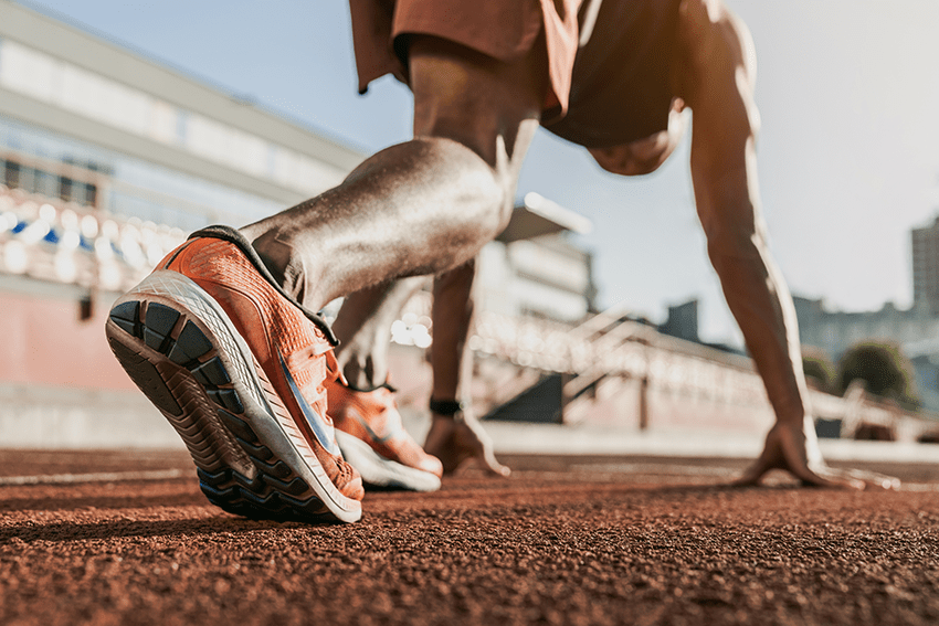 image of runner setting up for a race for blog about Elevate Your Game: CBD Products for Athlete Performance | Best workout supplement for men | best recovery supplement | athletic performance