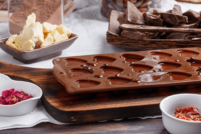image of chocolate in mold for blog about 2 Delectable CBD Chocolate Recipes: Love in Every Bite | Homemade chocolate | Homemade cbd chocolate
