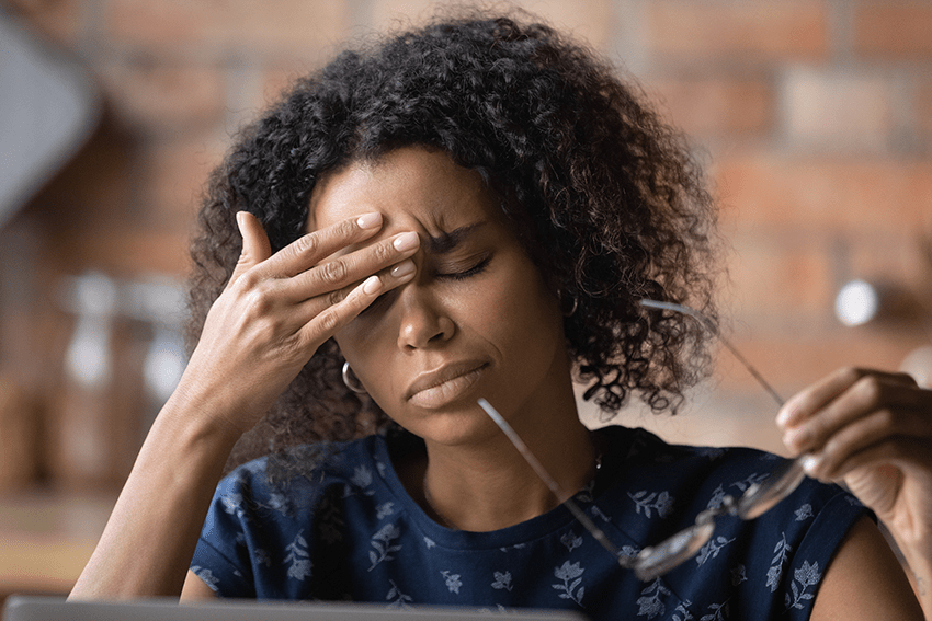 CBD for Headaches: 6 Products to Try to Get Rid of Headaches | cbd for mirgraines | does cbd help headaches | how to get rid of headaches | types of headaches | what causes headaches | home remedies for headaches | what helps with headaches | Lady holding her head from head pain