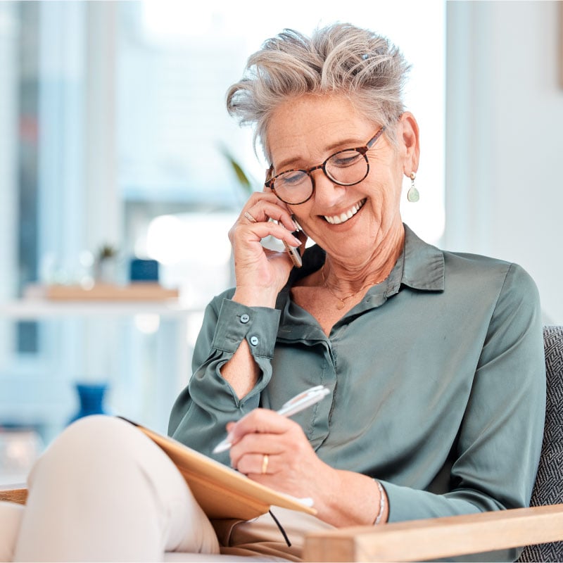 image of a happy lady on the phone with cbd customer support