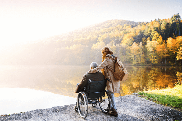 image of a senior couple by a lake with fall leaves for the blog about Savings Redefined: The Extract Labs Discount Program