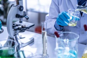 an image for the blog "High Quality CBD", man in a lab with microscope
