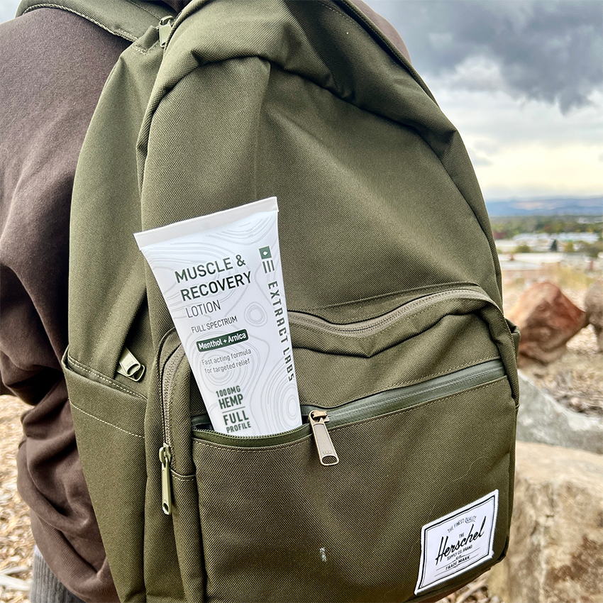 image of hemp Muscle & Recovery Lotion in backpack