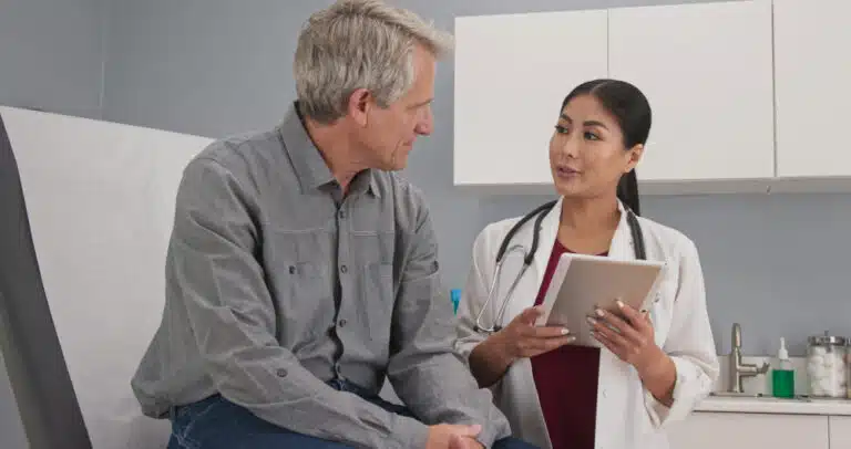 Senior patient consulting with physician about Medicare CBD coverage options