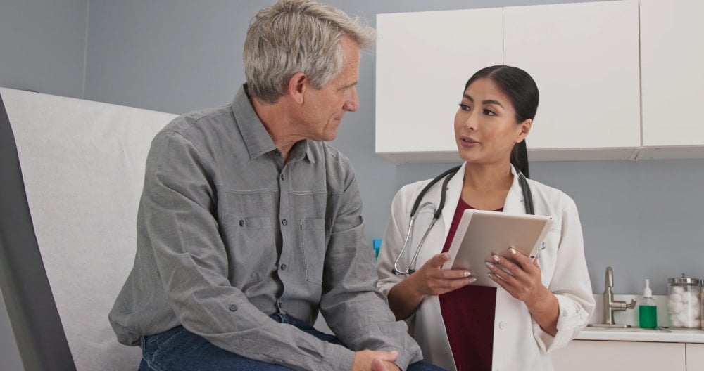 Senior patient consulting with physician about Medicare CBD coverage options